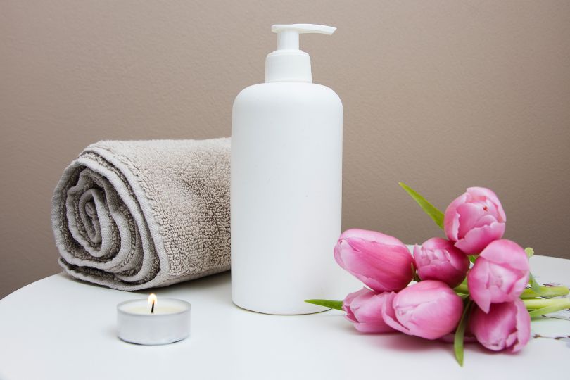 flowers, towel, candle and shampoo