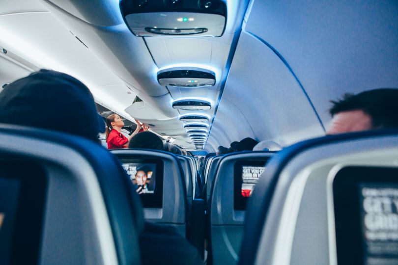 People sitting aboard airplane