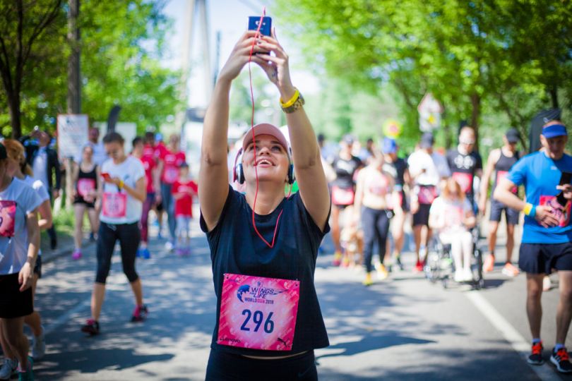 Girl taking a selfie on a marathon