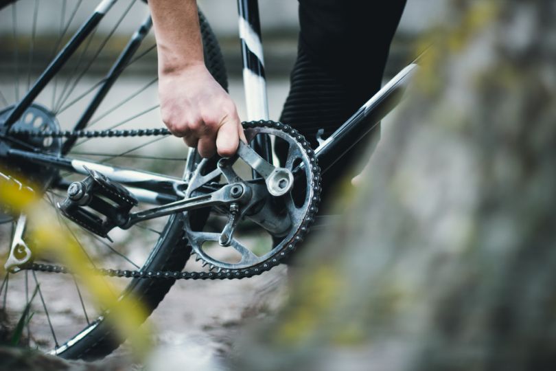 Man fixing his bike