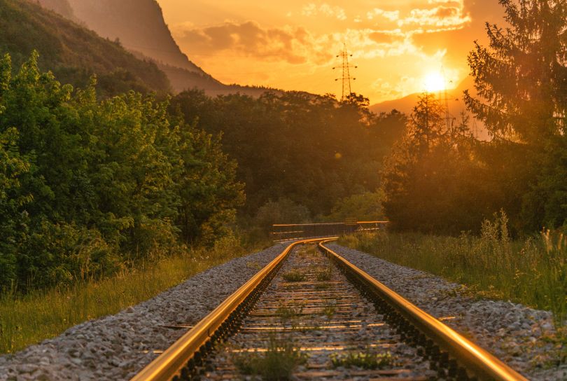 sunset in mountains over railroad