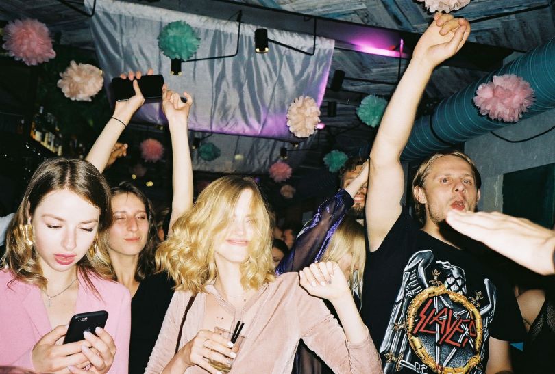 young people dancing in club