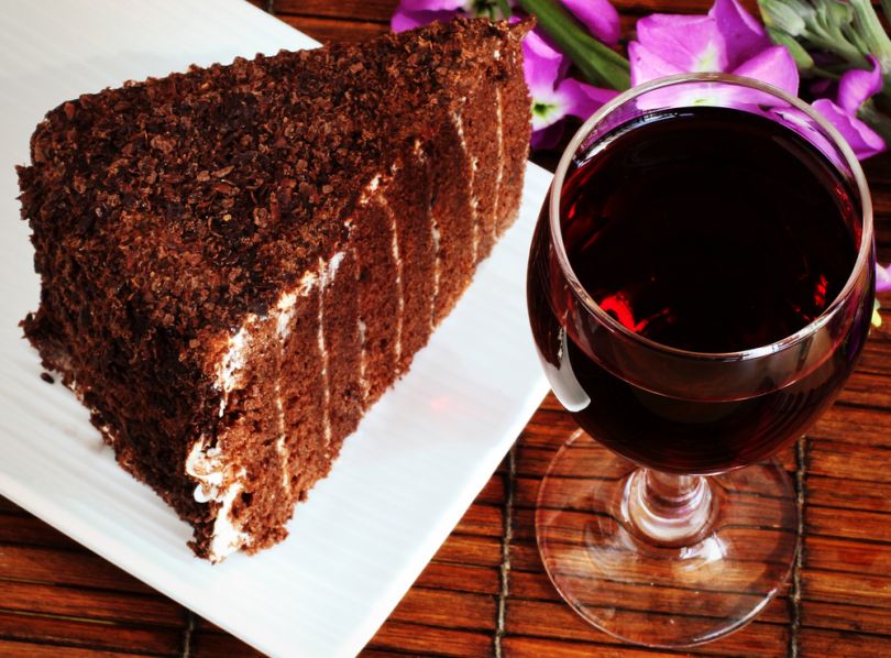 glass of red wine and cake