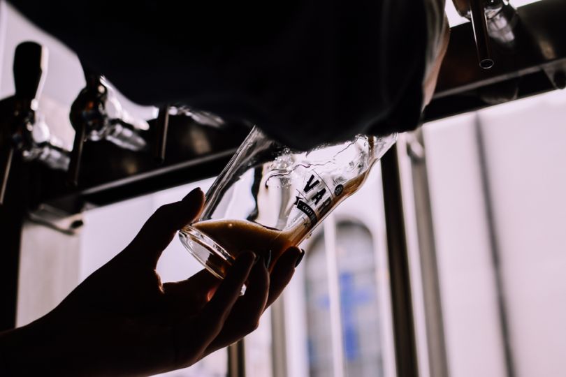 Man filling a glass of beer