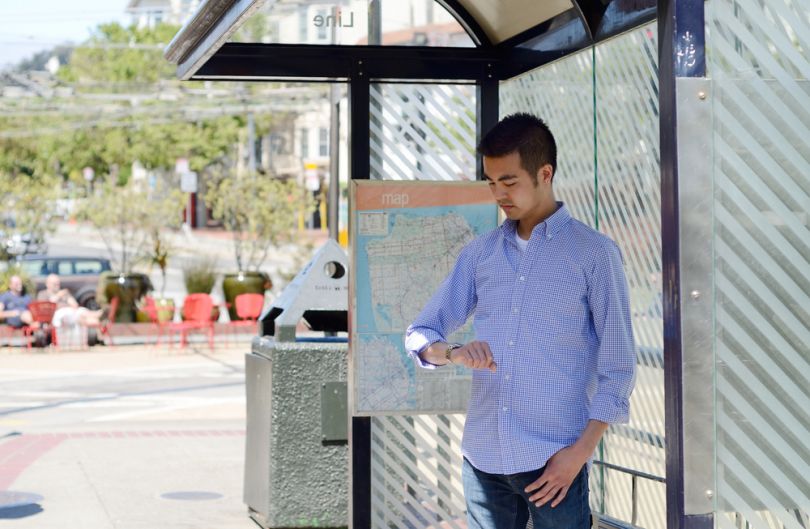 Man waiting for a bus on a bus stop