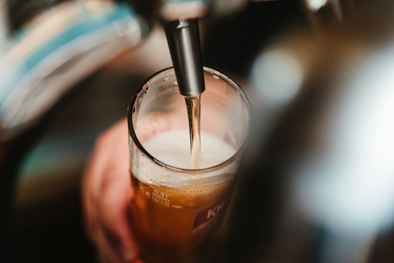 Pouring beer from tap