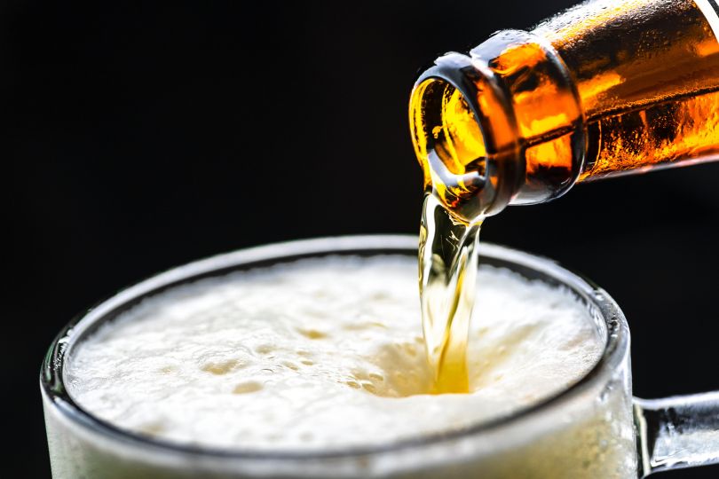 Pouring beer from a bottle