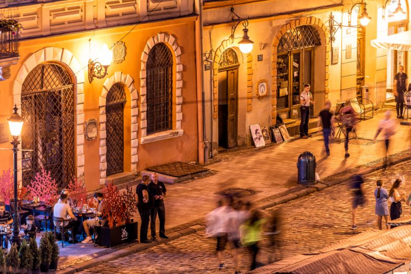 People chatting in night Lviv