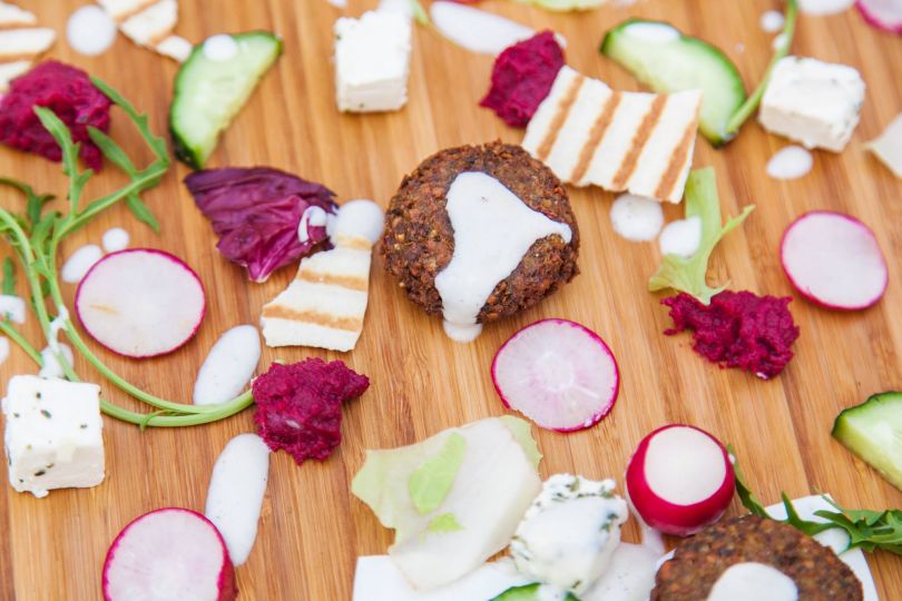 falafel and vegetables on wooden table