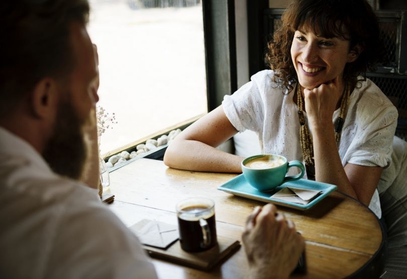 man and woman in cafe