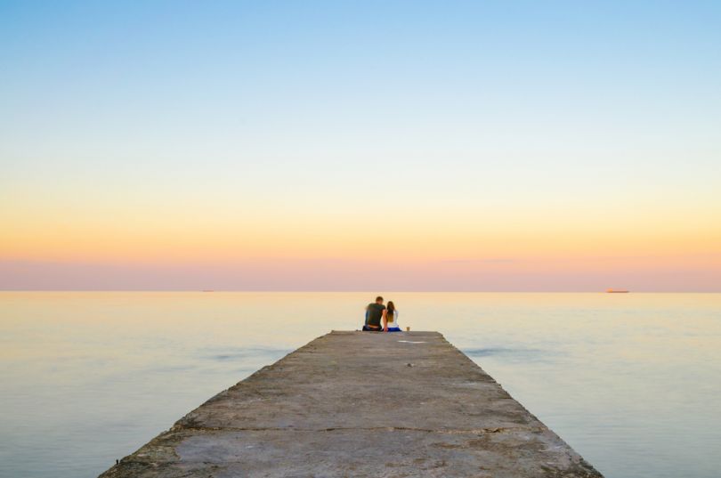 Couple meeting sunrise on Odesa beach