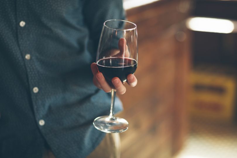 Man holding a glass of wine