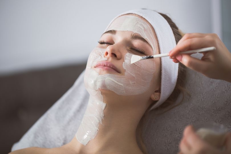 Woman getting a facial mask