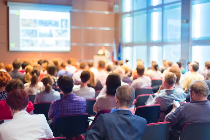 People sitting in rows on a conference