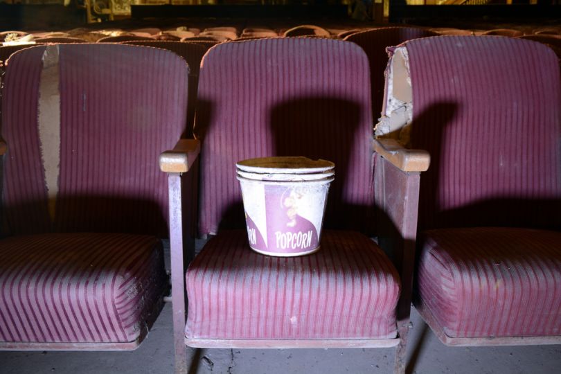 Empty cinema with a vintage popcorn bucket