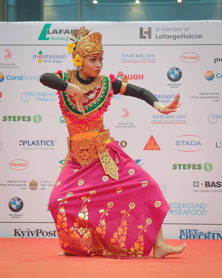 Women in traditional attire performing a dance