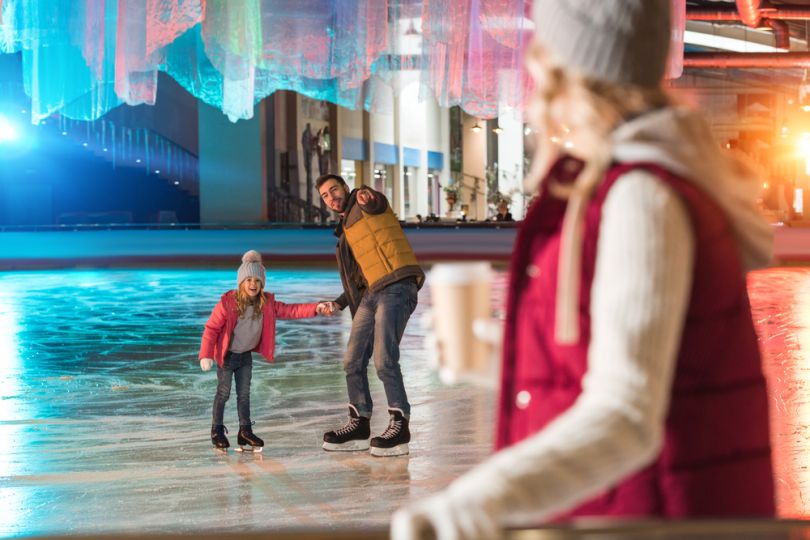 Family at a colorful ice rink