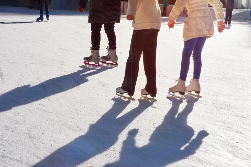 People ice skating outdoors