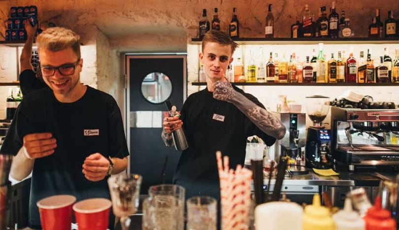 Tattooed bartender at ZVD in Kyiv