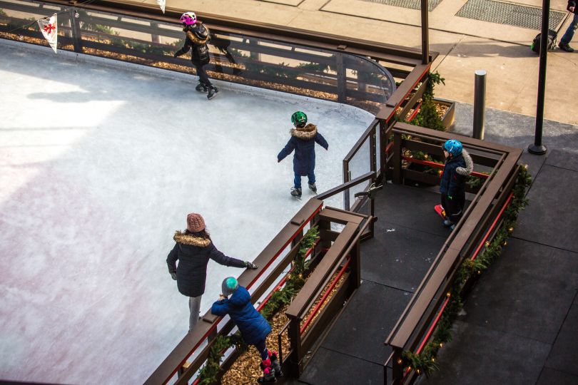 people skating on ice rink