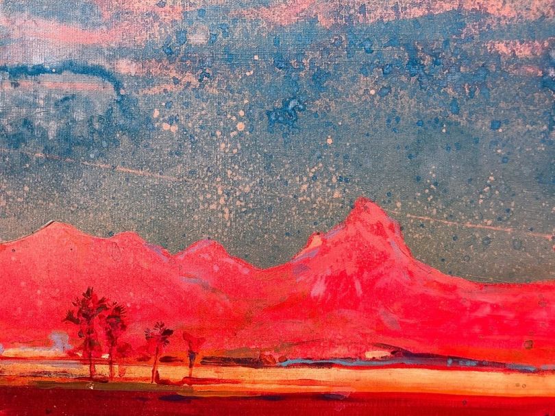 painting of mountains and river in red colors