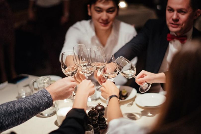 People toasting with wine