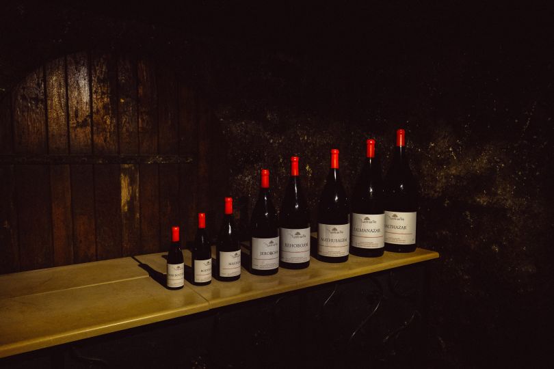 8 bottles of wine on table