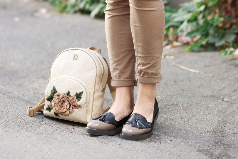 girl`s legs and bag