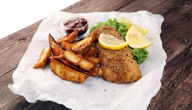 Fish and chips with sauce and lemon