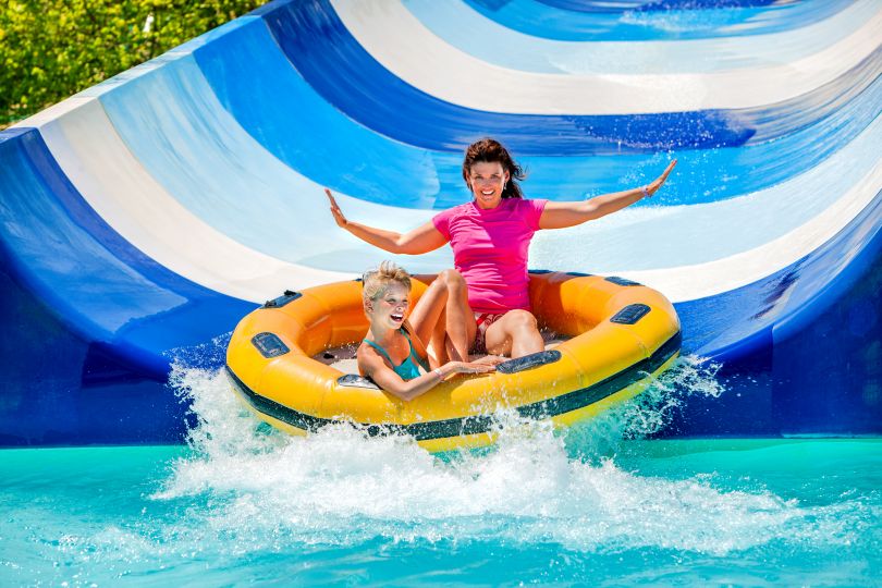 Woman sliding down in a water park