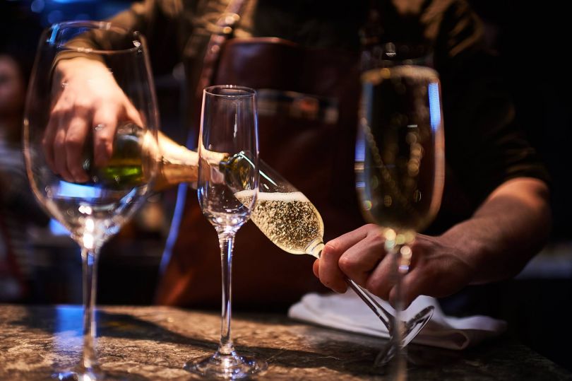 Bartender pouring champagne