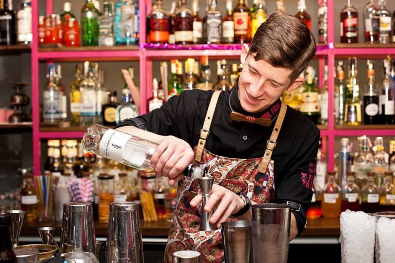 Bartender pouring a drink in Kyiv