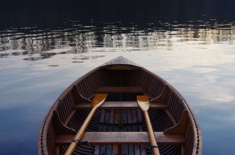 boat with paddles on water