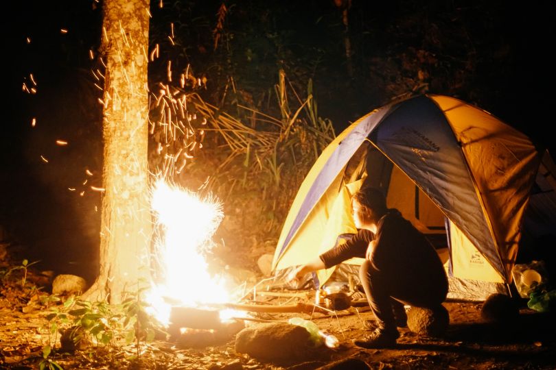Men near fire in a camping