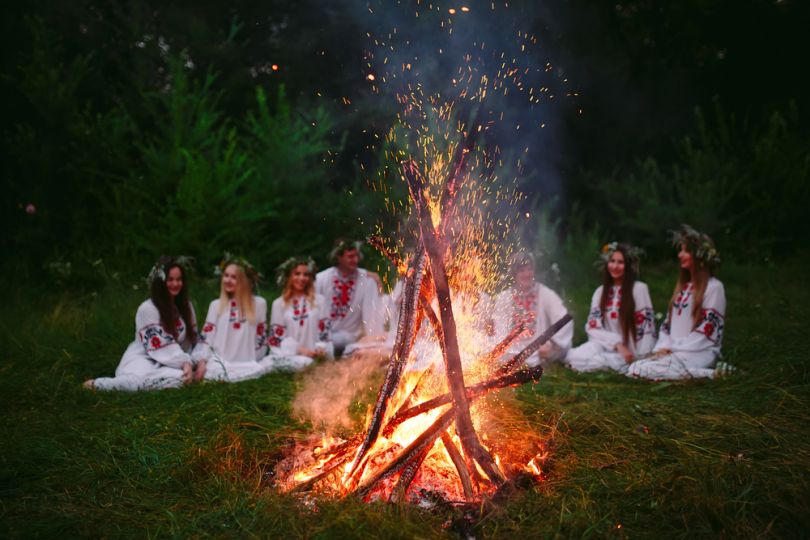 girls in white clothes near ivana kupala fire