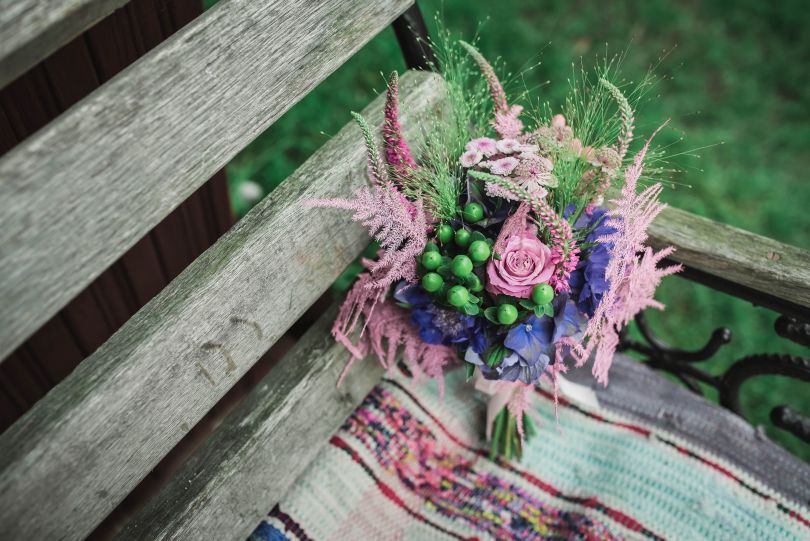 flowers composition on wooden bench