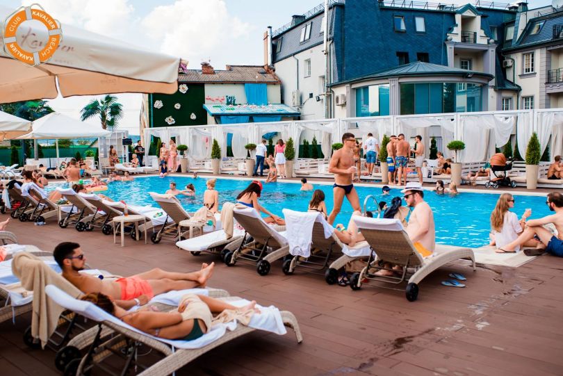 People chilling near a pool