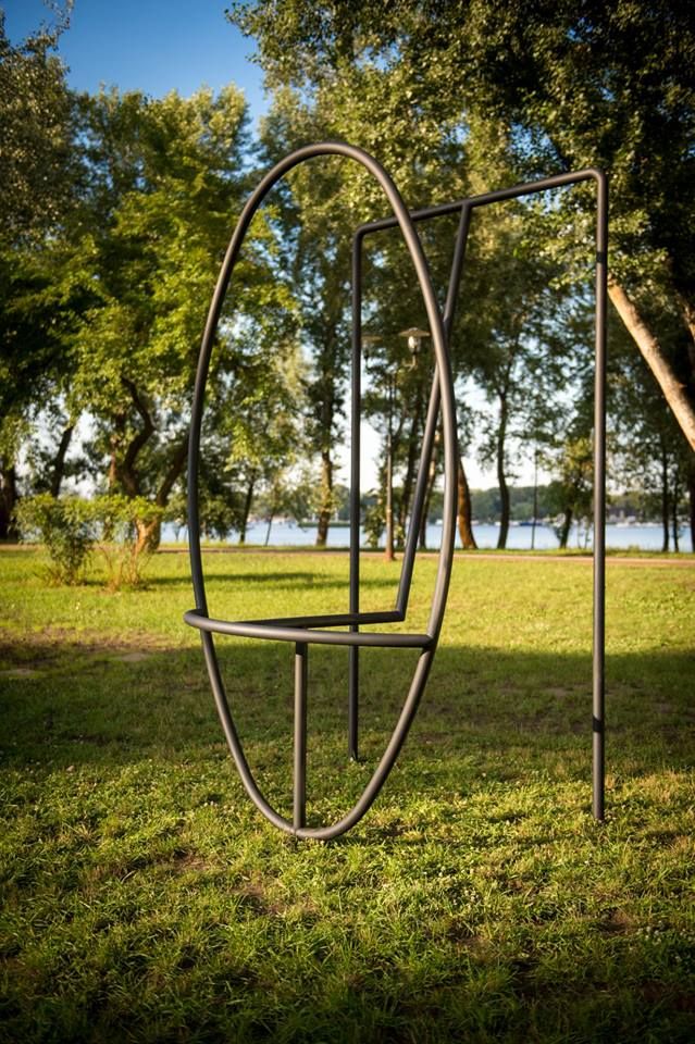 modern sculpture on green grass